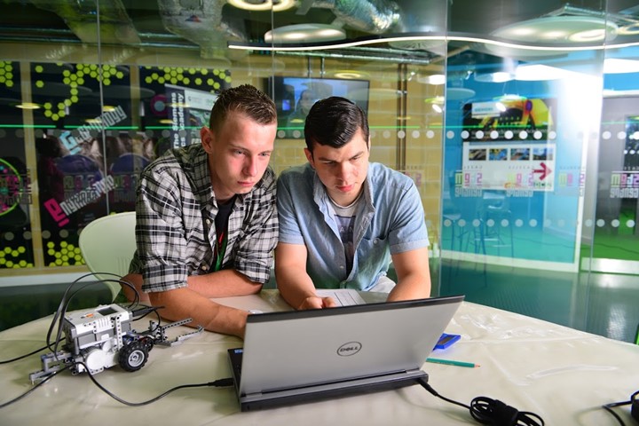 Two Engineering Students Working Together At A Computer