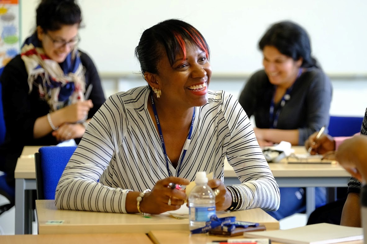 Female teacher smiling during a training course